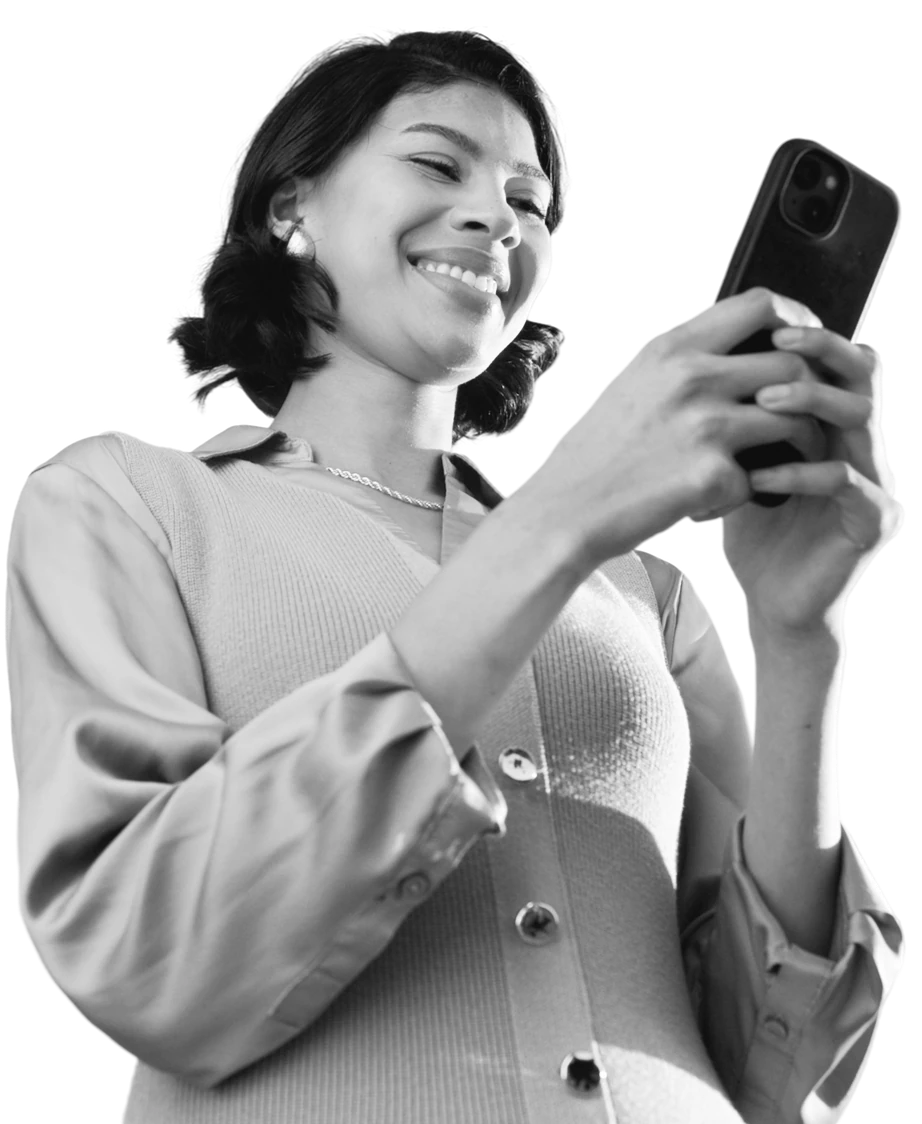 Smiling woman typing on her phone